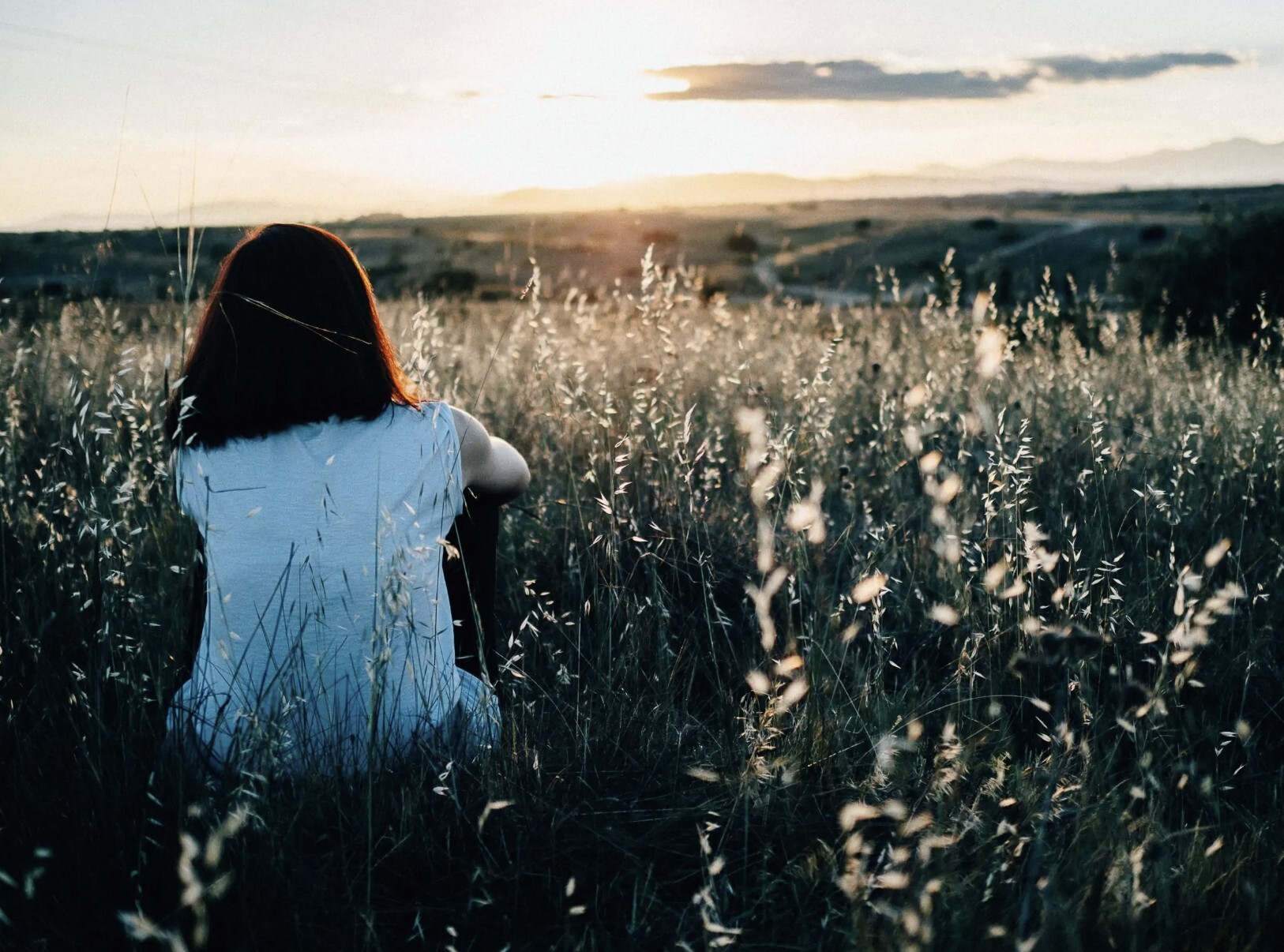 woman in grass field